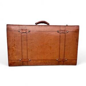 Vintage leather suitcase with metal